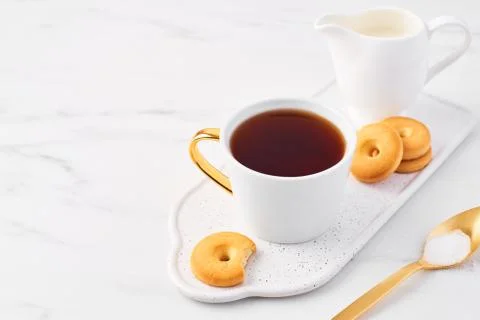 Cup of tea on white marble table top. Stock Photos