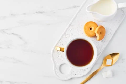Cup of tea on white marble table top. Stock Photos