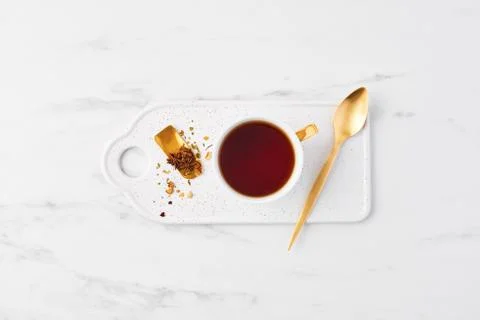 Cup of tea on white marble table top. Stock-Fotos