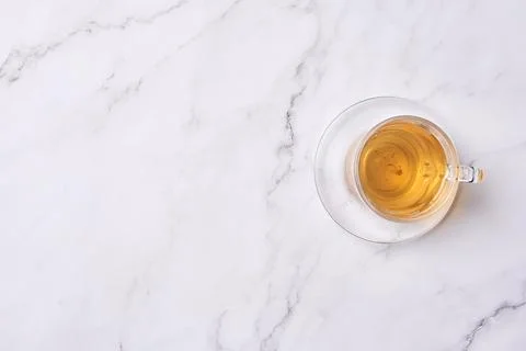 A cup of tea on a white marble table Stock Photos