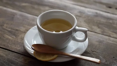 Cup with tea on a wooden table. Stock Footage 72146313