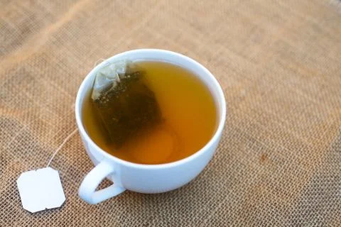 Cup of teabag on background table Stock Photos