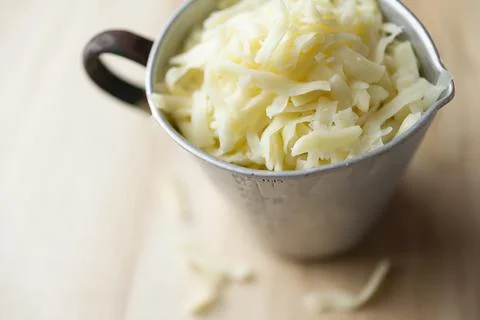 Cup of thick cut grated mozzarella Stock Photos