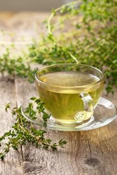 Cup of thyme tea Stock Photos