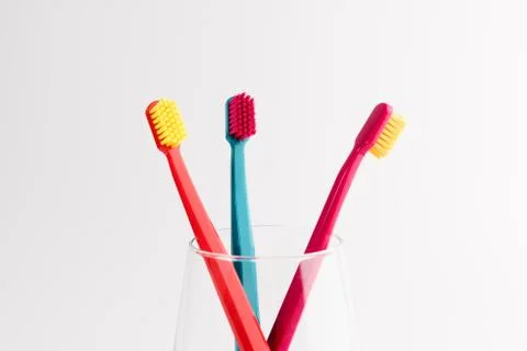 Cup with toothbrushes isolated on white background. Dental care Foto stock