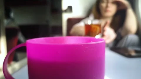 Cup on the train. Close-up of a plastic cup for coffee or tea on a train. Select Stock Footage 274473816