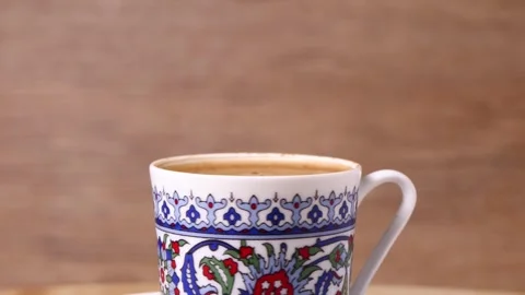 A cup of Turkish coffee rotate on a board Stock Footage 248367253