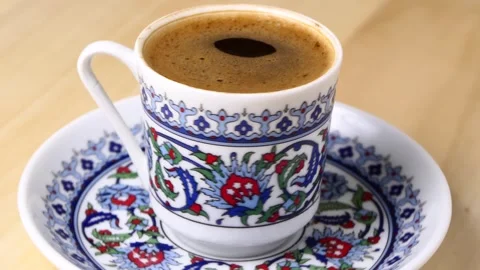 A cup of Turkish coffee rotating Stock Footage 248387280