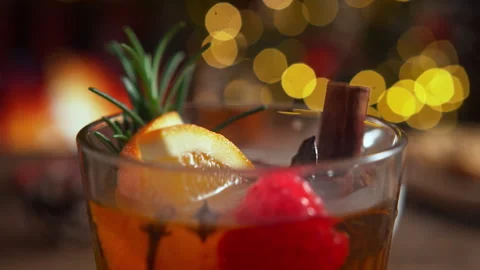Cup of Warming Christmas Winter Tea with Orange, Rosemary, Cinnamon and Cloves Stock Footage 208932392