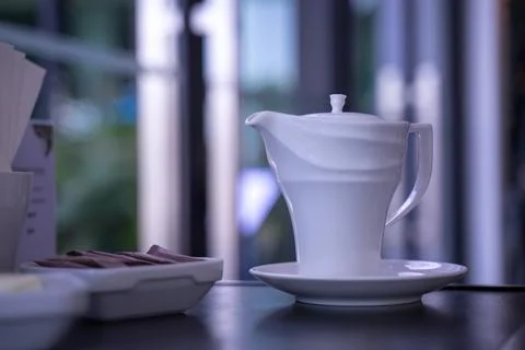 A cup of white tea lay on the table in the morning Stock Photos