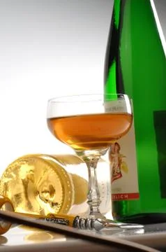 Cup white wine, bottle, corkscrew Stock Photos