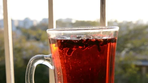 Cup on window sill with lockable tea Stock Footage 124747906