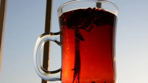 Cup on window sill with lockable tea Stock-Footage 124747991