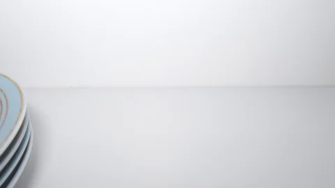 Cupboard is opened. Front view of concentrated man in glasses cleans white shelf Stock Footage 128028256