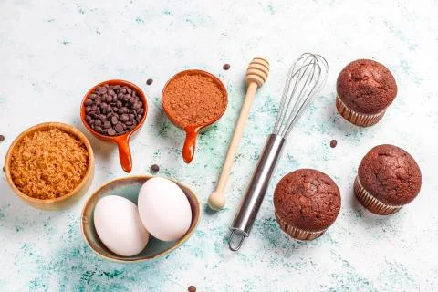 Cupcake baking background with kitchen utensils. Stock Photos