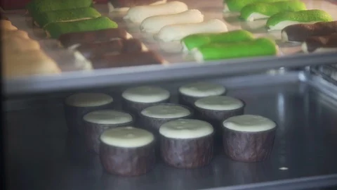 Cupcake. Baking in oven. Time lapse footage of cooking muffins and eclair Stock-Footage 96141908