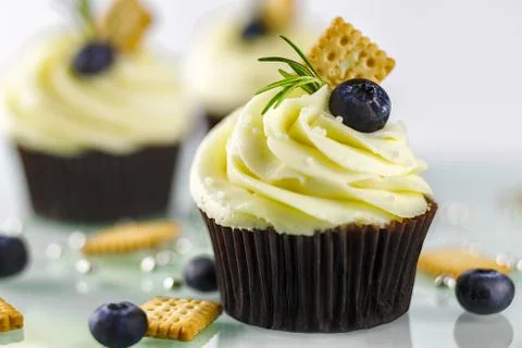 Cupcake with biscuits Stock Photos
