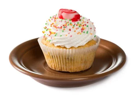 Cupcake on brown plate Stock Photos
