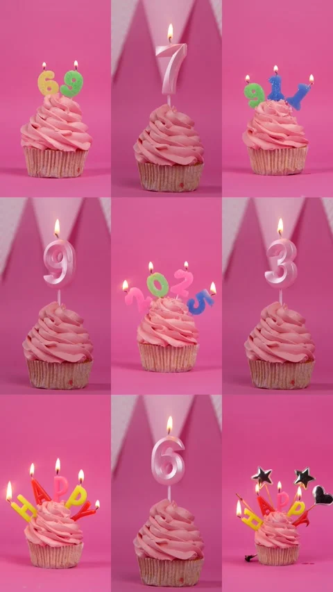Cupcake with burning multi-colored candles on a pink background. vertical video Stock Footage 296201425