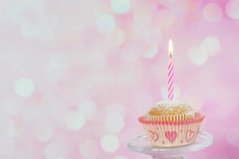 Cupcake with candle Stock Photos