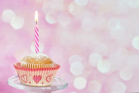 Cupcake with candle Stock Photos