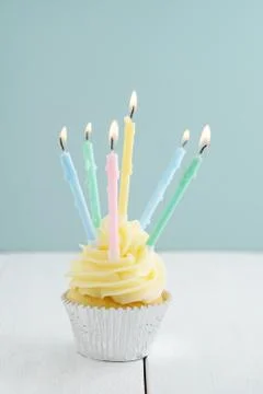 Cupcake with candles Stock Photos