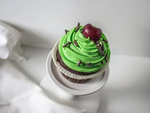 Cupcake with cherry Stock Photos