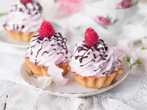 Cupcake with chocolate and raspberry, selective focus Stock Photos
