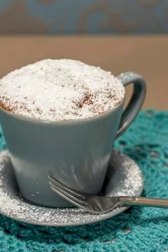 Cupcake in a coffee mug Stock Photos
