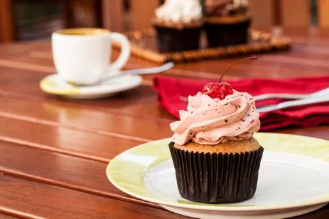 Cupcake with coffee Stock Photos