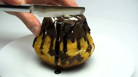 Cupcake is cutting by knife. Close up. Stock Footage 86574019