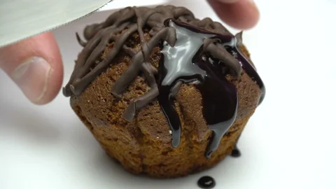 Cupcake is cutting by knife. Close up. Stock Footage 86767309