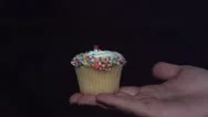 Cupcake Exploding In Hand Stock Footage