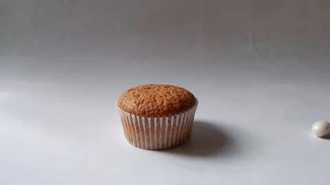 Cupcake with heart on a stick on white background Stock Footage 123843852