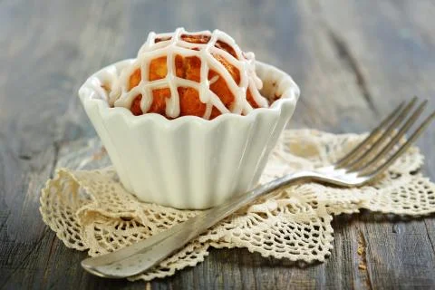 Cupcake with icing and fork. Stock Photos