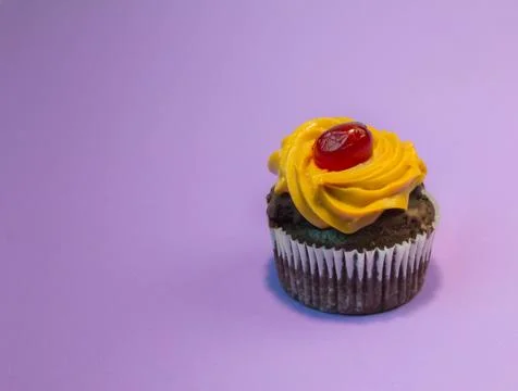 Cupcake on a light purple background Stock Photos