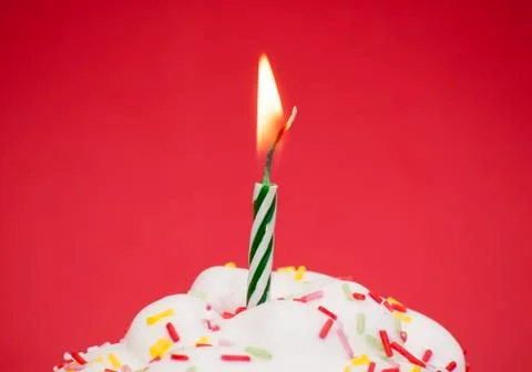 Cupcake with a lit candle Stock Photos