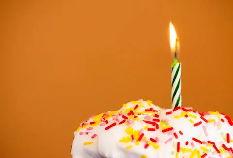 Cupcake with a lit candle Stock Photos