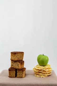 Cupcake next to an apple on a white background 写真素材