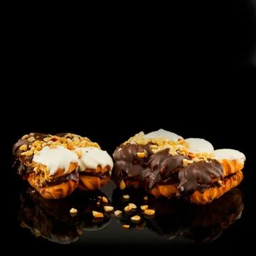 Cupcake with nuts and mirror reflection. Cake and highlight. Sweet time Stock Photos