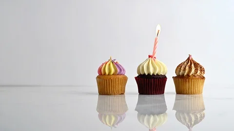 Cupcake party with candle Stock Footage 112107536