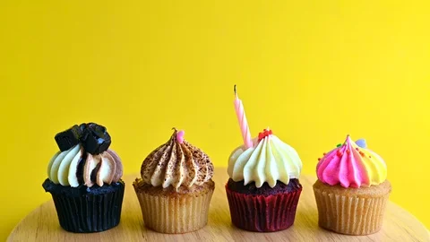 Cupcake party with candle Stock Footage 112107808