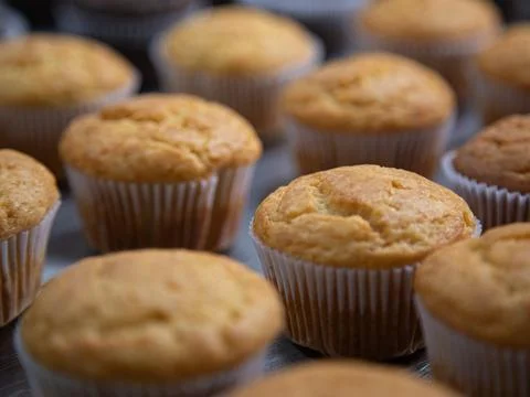 Cupcake production inside the bakery Stock Photos