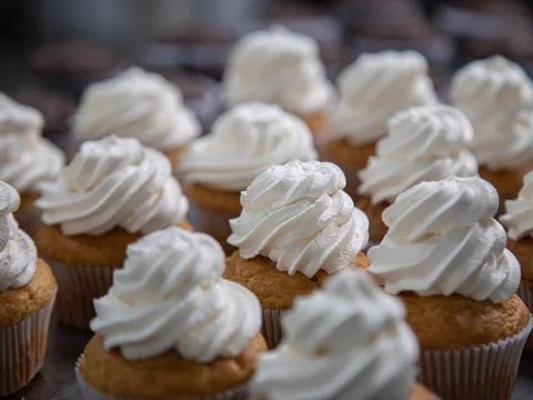 Cupcake production inside the bakery Stock Photos