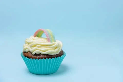 Cupcake with rainbow decoration Stock Photos