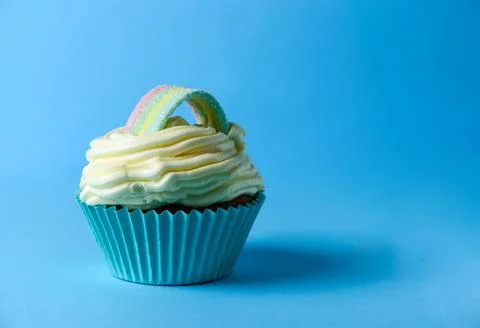 Cupcake with rainbow decoration Stock Photos