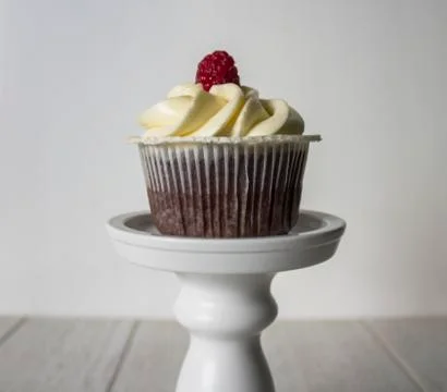 Cupcake with raspberry Stock Photos