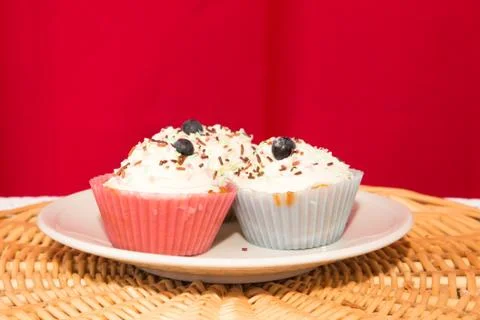 Cupcake on a red background Stock Photos