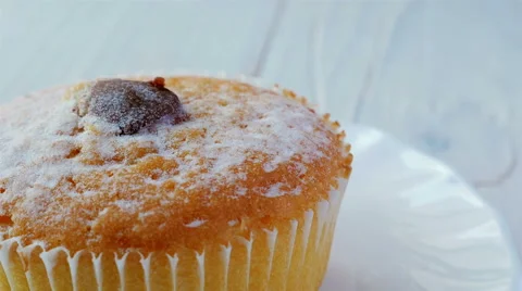 Cupcake sprinkled with cocoa Stock Footage 58439781