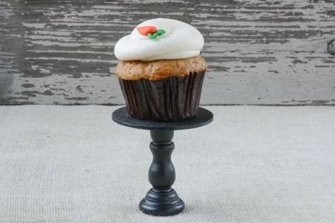 Cupcake on stand with rustic backgound Stock Photos